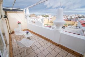 A balcony or terrace at Petit Palace Canalejas Sevilla
