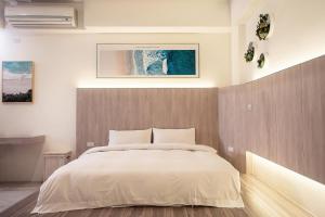 Postel nebo postele na pokoji v ubytování ManMan B&B