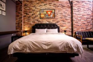 Postel nebo postele na pokoji v ubytování ManMan B&B