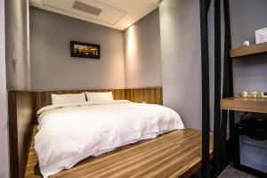 Postel nebo postele na pokoji v ubytování ManMan B&B