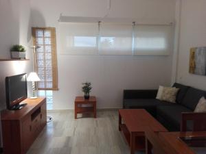 Ein Sitzbereich in der Unterkunft Cozy Loft Torremolinos