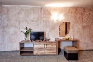 a room with a desk with a mirror and a chair at Platinum Image Hotel in Elin Pelin +22 photos