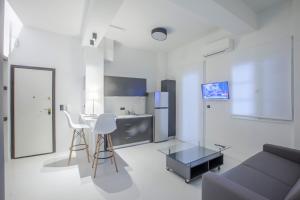 Televizorius ir (arba) pramogų centras apgyvendinimo įstaigoje Thessaloniki Center Apartments