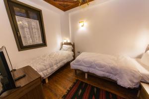 Postel nebo postele na pokoji v ubytování Hotel Onufri