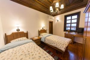 Postel nebo postele na pokoji v ubytování Hotel Onufri