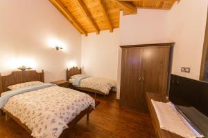 Postel nebo postele na pokoji v ubytování Hotel Onufri