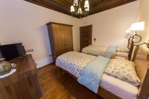 Postel nebo postele na pokoji v ubytování Hotel Onufri