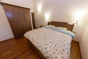 Postel nebo postele na pokoji v ubytování Hotel Onufri