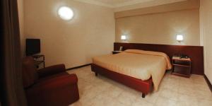 Postel nebo postele na pokoji v ubytování Hotel Forum