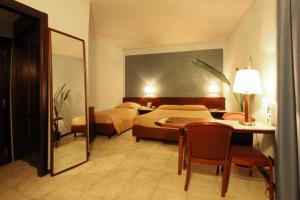 Postel nebo postele na pokoji v ubytování Hotel Forum
