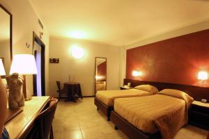 Postel nebo postele na pokoji v ubytování Hotel Forum