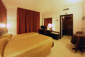 Postel nebo postele na pokoji v ubytování Hotel Forum