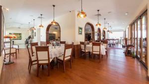 a dining room with tables and chairs in a restaurant at My Soul Resort in Knić
