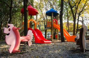 a playground with different types of play equipment at Agriturismo Amicizia in Cassano delle Murge