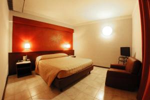 Postel nebo postele na pokoji v ubytování Hotel Forum