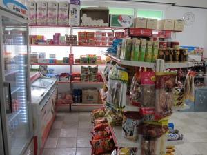 a grocery store aisle with food on shelves at Green Valley in Sancheong