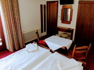 Ein Bett oder Betten in einem Zimmer der Unterkunft Mosers Pension