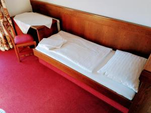 Ein Bett oder Betten in einem Zimmer der Unterkunft Mosers Pension