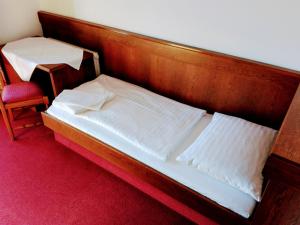 Ein Bett oder Betten in einem Zimmer der Unterkunft Mosers Pension