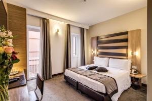 Postel nebo postele na pokoji v ubytování Hotel Trevi - Gruppo Trevi Hotels