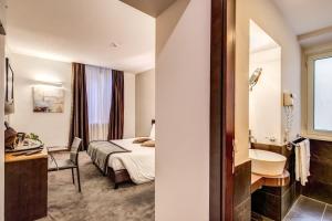 Postel nebo postele na pokoji v ubytování Hotel Trevi - Gruppo Trevi Hotels