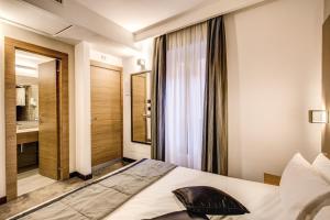 Postel nebo postele na pokoji v ubytování Hotel Trevi - Gruppo Trevi Hotels