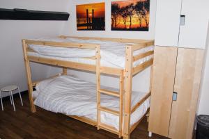 a couple of bunk beds in a room at City Hostel Vlissingen in Vlissingen