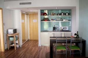 Kjøkken eller kjøkkenkrok på Velence Resort Apartman
