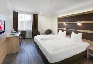 Μια τηλεόραση ή/και κέντρο ψυχαγωγίας στο Michel Hotel Landshut Kaiserhof