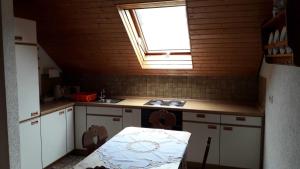a small kitchen with a sink and a window at Ferienwohnung Gareus in Zittenfelden