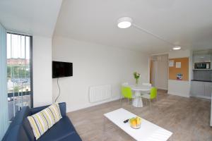 a living room with a couch and a table at University Hall Apartments - UCC Summer Beds in Cork