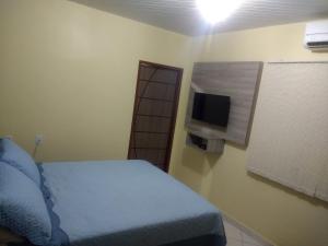เตียงในห้องที่ Hotel Goiânia