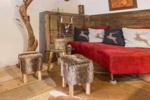 A bed or beds in a room at Schusterbrand Appartements