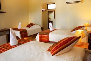 Postel nebo postele na pokoji v ubytování Arena Blanca Eco Hotel