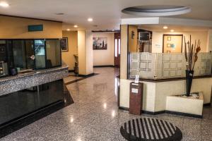 a lobby of a hotel with a waiting room at Hotel La Luna in Mexico City