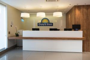 a view of a days inn reception desk in a lobby at Days Inn by Wyndham Rio de Janeiro Lapa in Rio de Janeiro