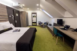 Postel nebo postele na pokoji v ubytování Hotel Castellum