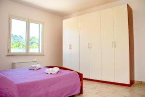 Postel nebo postele na pokoji v ubytování Casa Vacanze Eufemia