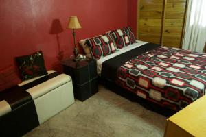 Postel nebo postele na pokoji v ubytování One32 Guesthouse Paradise
