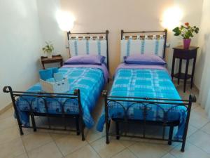 A bed or beds in a room at B&B Is Janas E5391