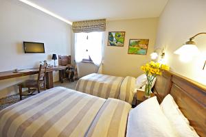 
Łóżko lub łóżka w pokoju w obiekcie Hotel Chutor Kozacki
