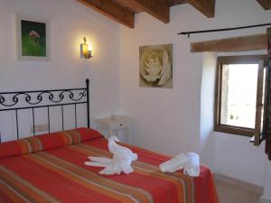 Кровать или кровати в номере Agroturismo Sa Duaia