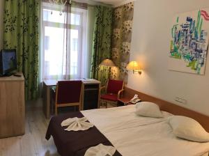 Postel nebo postele na pokoji v ubytování A1 Hotel Riga City Center