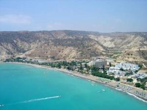 an aerial view of a beach with buildings and the ocean at Zena Holiday Villa in Pissouri