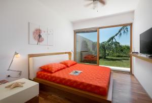 Postel nebo postele na pokoji v ubytování Casa Vidmar + 14 fotografií