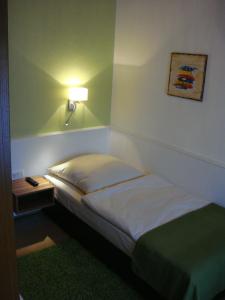 Postel nebo postele na pokoji v ubytování Hotel Smart-Inn