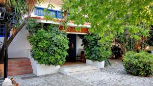 a building with plants on the side of it at Oasis Hotel Bungalows Rhodes- All Inclusive in Afantou
