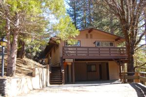 a house with a staircase leading up to it at 99 Yosemite Mountain Lodge in Wawona