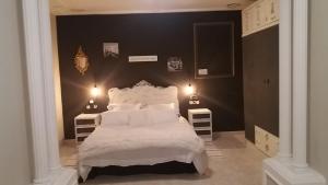 Łóżko lub łóżka w pokoju w obiekcie Villa los Angeles Piscine privée 16 pers