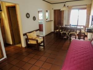 a living room with a table and a dining room at Rincon Grande Duplex in Miramar